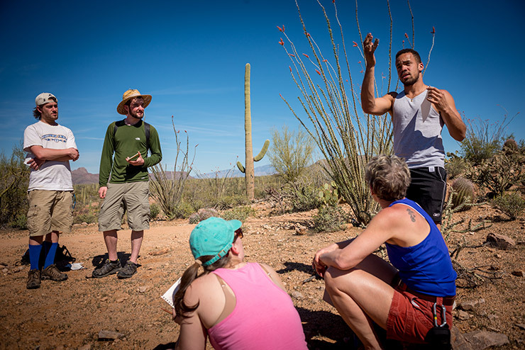 Colby-Sawyer students examin the desert landscpe during Desert Communities field studies class