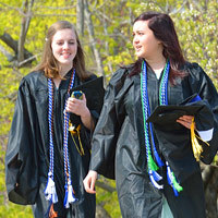Graduates walking together at commencement