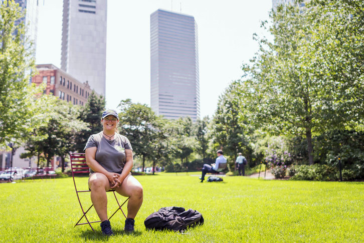 Colby-Sawyer student Nicole Sememaro ’18 sits on a chair in Boston's Rose Kennedy Greenway.