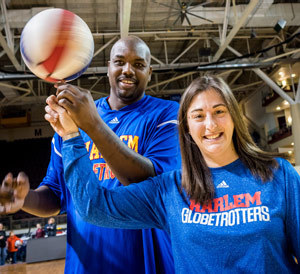 Stephanie Guzzo on the court with the Harlem Globetrotters