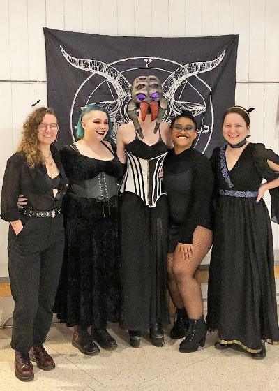 Members of the Colby-Sawyer PRIDE club pictured in costumes for the bi-annual drag ball. 